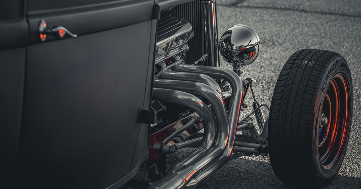 Side shot of an old Black and Red Hot Rod