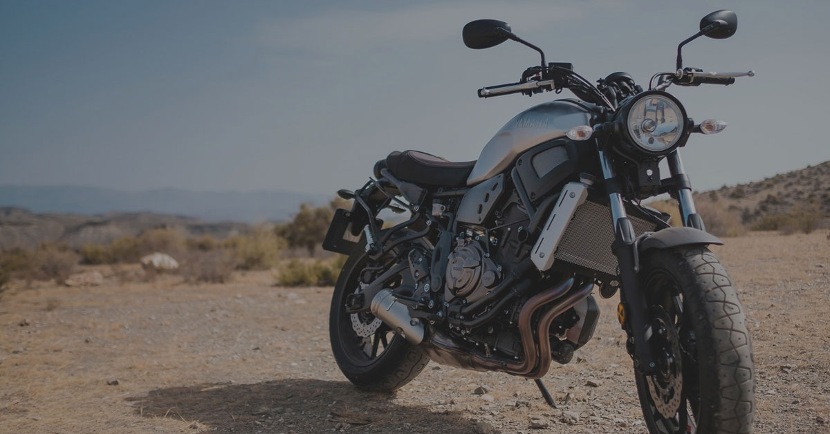 a motorcycle parked in a desert